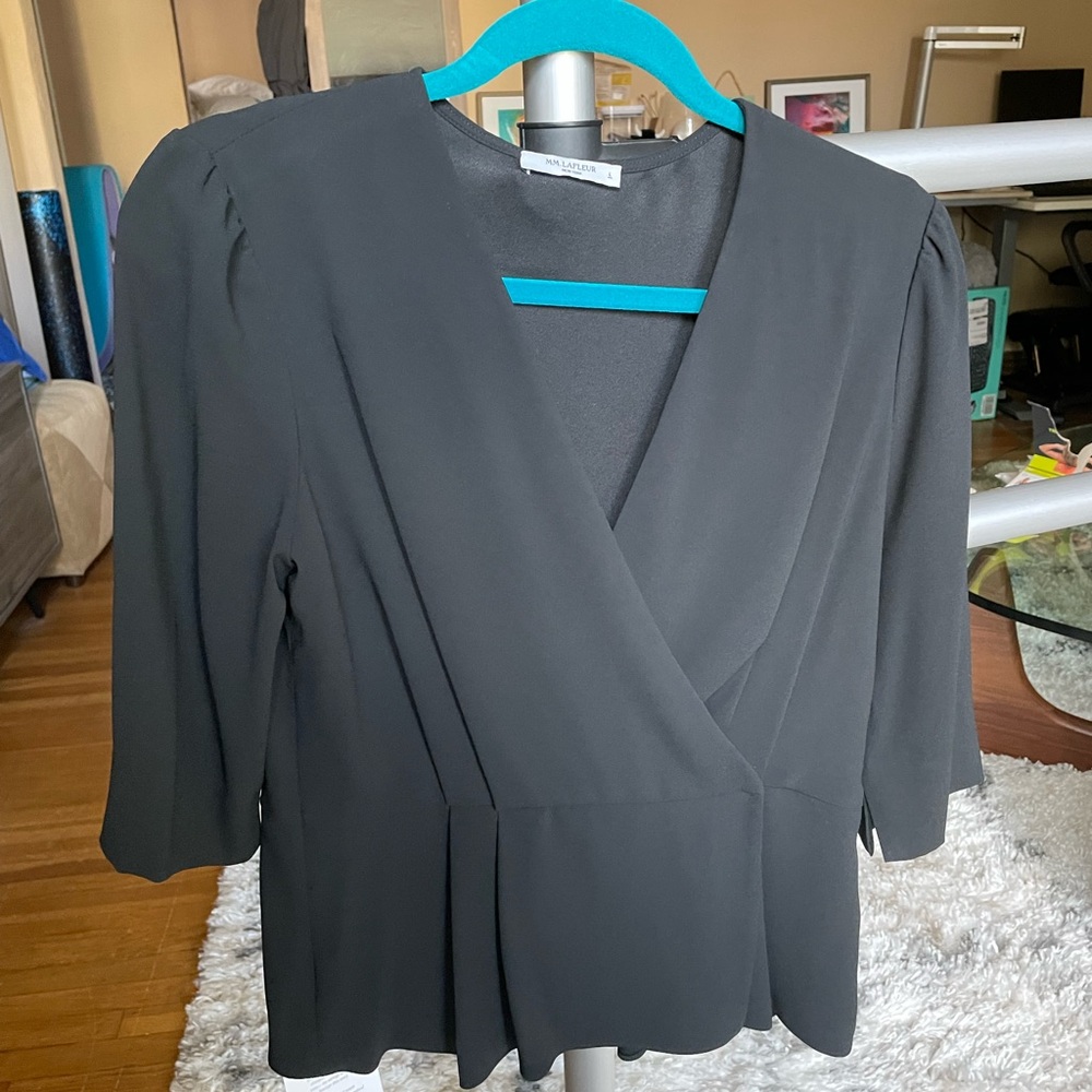 Never worn women’s 3/4 sleeve blouse with peplum waist and built in camisole.